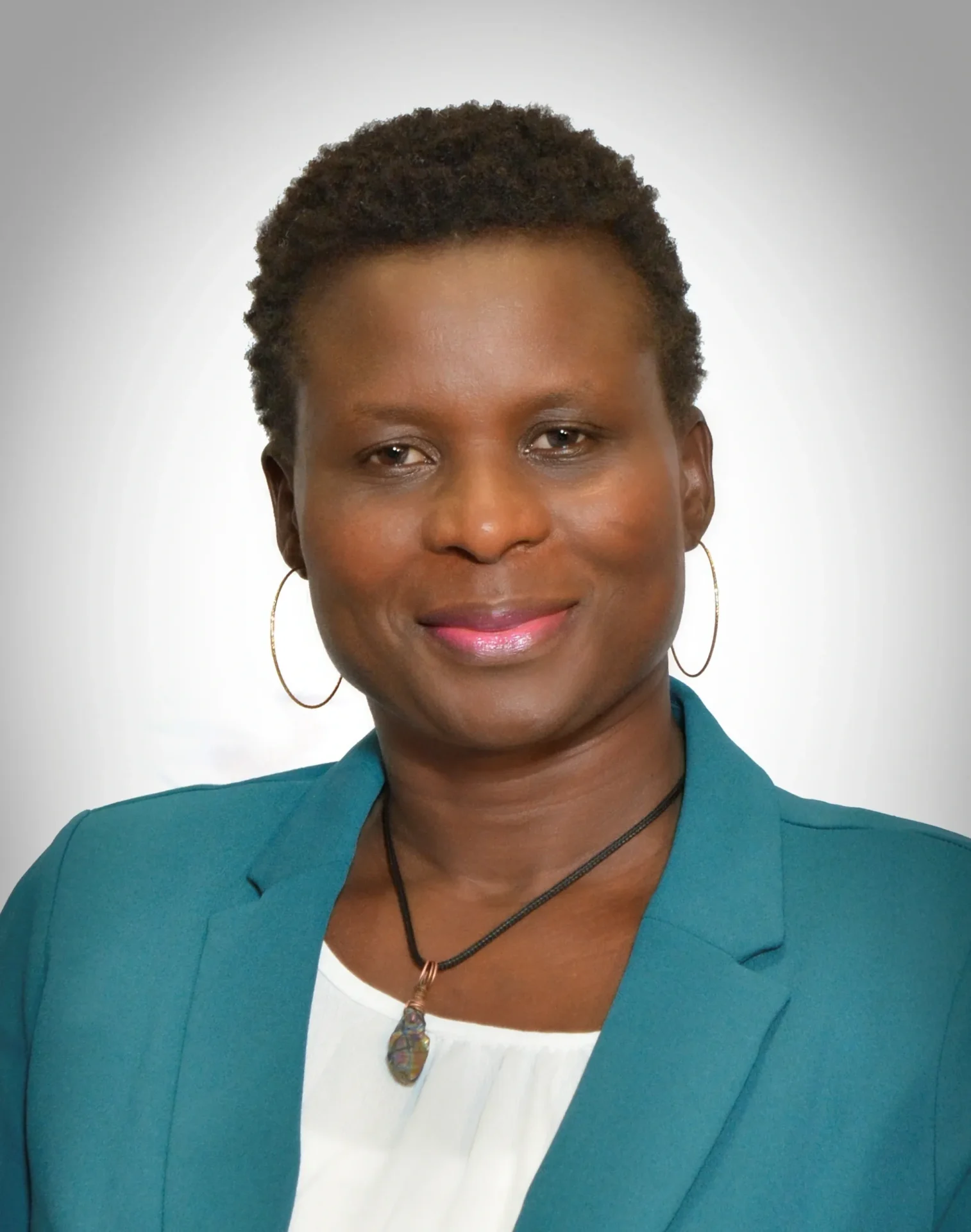 A woman in a blue jacket and white shirt